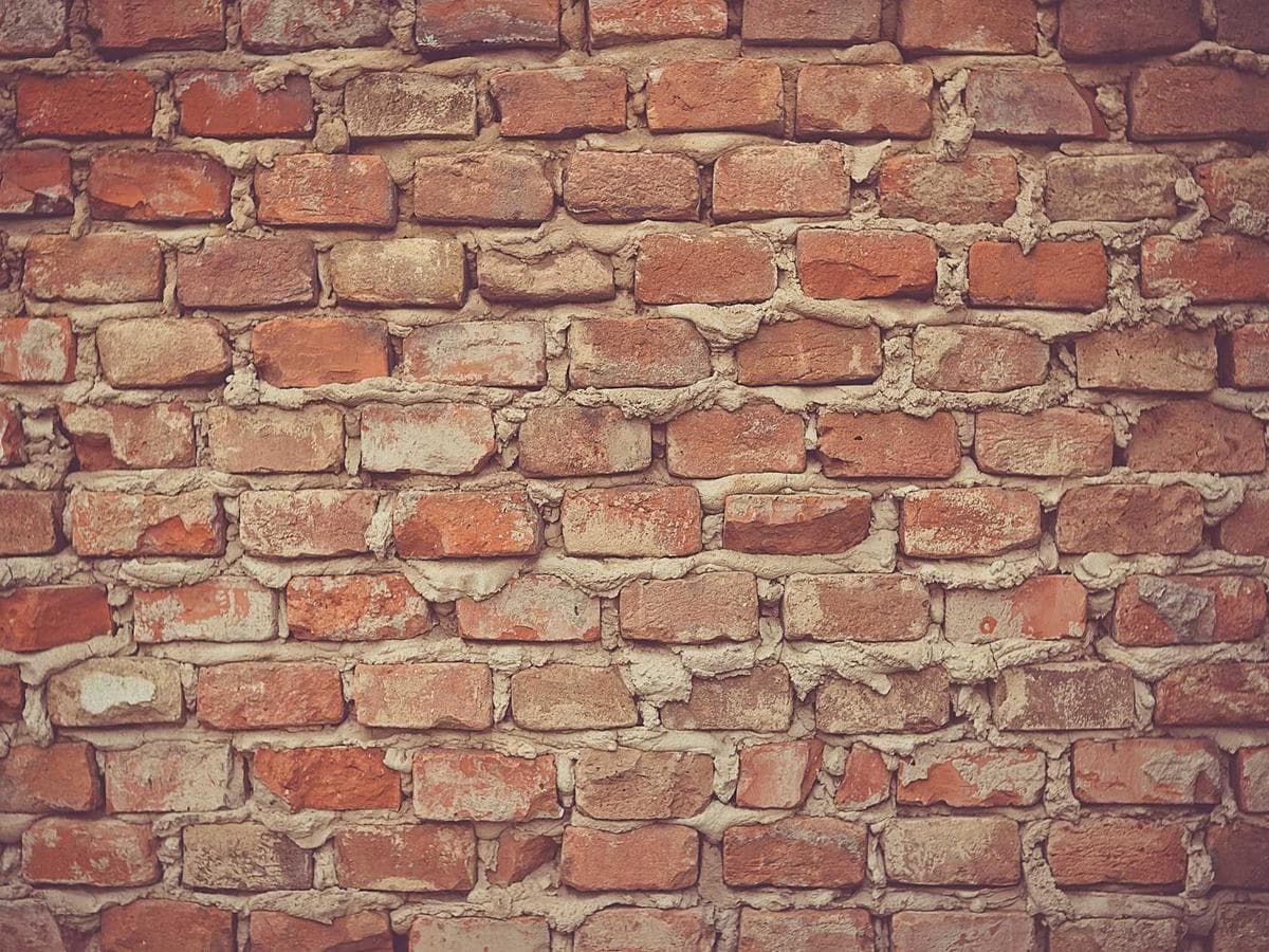 Repeating masonry blocks forming a dense wall