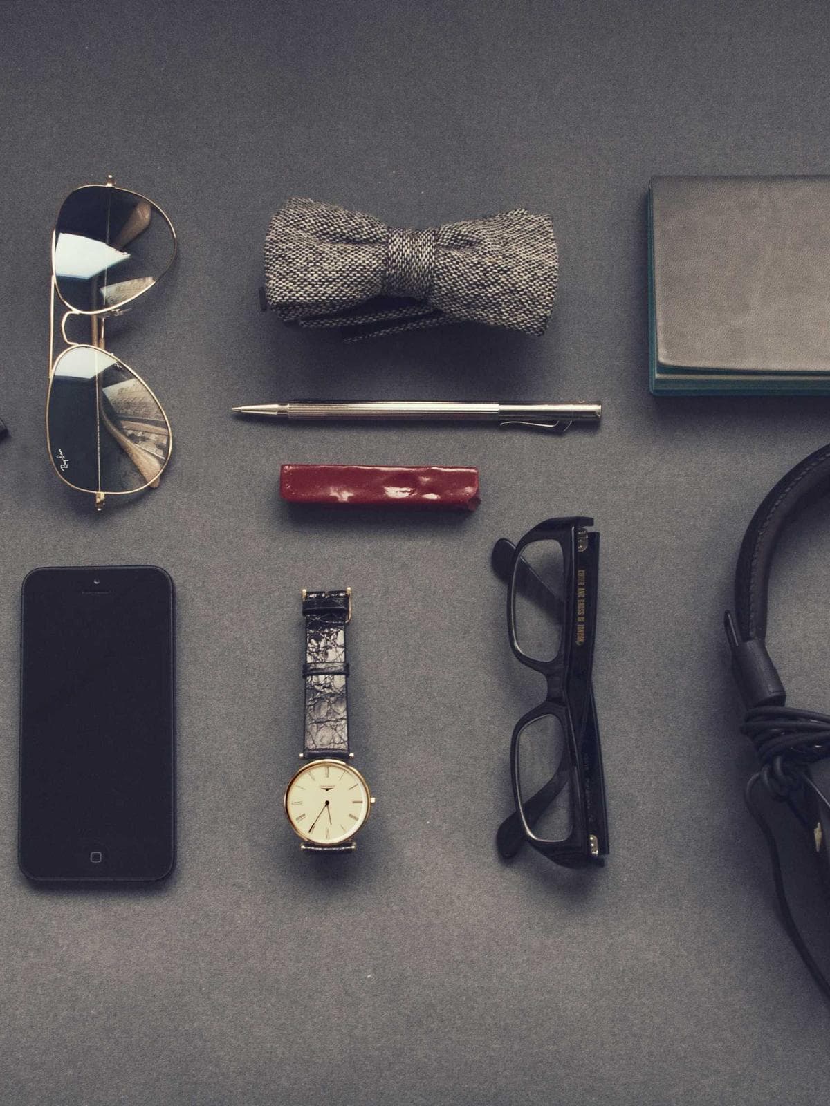 Flat-lay of precision device components on a dark surface
